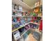 Walk-in pantry with neatly arranged shelves filled with various food items at 6460 Wagon Wheel Ct, Pahrump, NV 89061