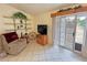 Cozy sitting area off the main bedroom features comfortable seating and natural light at 6460 Wagon Wheel Ct, Pahrump, NV 89061