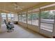 Enclosed sun room featuring multiple windows and comfortable seating at 6460 Wagon Wheel Ct, Pahrump, NV 89061