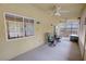 Enclosed sun room featuring multiple windows and comfortable seating at 6460 Wagon Wheel Ct, Pahrump, NV 89061