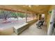 Enclosed sun room featuring multiple windows and comfortable seating, backyard view at 6460 Wagon Wheel Ct, Pahrump, NV 89061