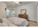 Comfortable bedroom with wood-look flooring, ceiling fan, and ample closet space at 6480 Annie Oakley Dr # 314, Las Vegas, NV 89120