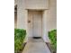 A welcoming condo entrance featuring a secure gate and well-maintained front yard landscaping at 6480 Annie Oakley Dr # 314, Las Vegas, NV 89120