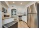 Well-lit kitchen with granite countertops and stainless steel appliances, including microwave and refrigerator at 6480 Annie Oakley Dr # 314, Las Vegas, NV 89120