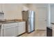 Kitchen featuring a stainless steel refrigerator, granite countertops, and ample cabinet space at 6480 Annie Oakley Dr # 314, Las Vegas, NV 89120
