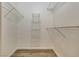 Spacious walk-in closet offers ample storage with wire shelving and wood-look flooring at 6480 Annie Oakley Dr # 314, Las Vegas, NV 89120