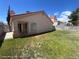 Fully fenced backyard with green grass, ideal for relaxing or entertaining in a private outdoor space at 6512 Sterling Springs Pkwy, Las Vegas, NV 89108
