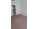 Bedroom showcasing neutral carpeting and an attached bathroom at 6512 Sterling Springs Pkwy, Las Vegas, NV 89108