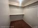 Spacious walk-in closet with shelving and carpeted floor at 6512 Sterling Springs Pkwy, Las Vegas, NV 89108