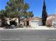 Charming single-story home featuring desert landscaping, a two-car garage and a terra cotta tiled roof at 6512 Sterling Springs Pkwy, Las Vegas, NV 89108