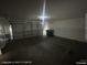 Garage featuring a large door and ample space at 6512 Sterling Springs Pkwy, Las Vegas, NV 89108