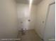 Laundry room showcasing tile flooring and washer and dryer hookups at 6512 Sterling Springs Pkwy, Las Vegas, NV 89108