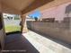 Covered patio area with tiled flooring and block wall perimeter, ideal for outdoor lounging and shade at 6512 Sterling Springs Pkwy, Las Vegas, NV 89108