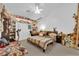 Cozy bedroom with teddy bears, a ceiling fan, and ample natural light from a window at 6631 Creeping Thyme St, Las Vegas, NV 89148