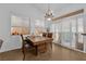 Charming dining area with natural light and a rustic chandelier at 6631 Creeping Thyme St, Las Vegas, NV 89148