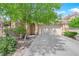 Well-maintained home features a two-car garage, manicured landscaping, and inviting front entrance at 6631 Creeping Thyme St, Las Vegas, NV 89148