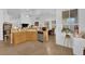 Bright, open kitchen with light wood cabinets, stainless steel appliances, and an adjacent dining area at 6631 Creeping Thyme St, Las Vegas, NV 89148