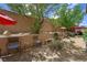 Relaxing backyard with chairs and lush greenery, offering a serene outdoor space at 6713 Guidestar St, North Las Vegas, NV 89084