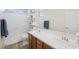 Bright bathroom with double sink vanity, modern fixtures, and a shower over tub at 6713 Guidestar St, North Las Vegas, NV 89084