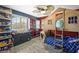 bedroom featuring hardwood floors, a ceiling fan and a house shaped bed with ladder at 6713 Guidestar St, North Las Vegas, NV 89084