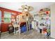 bedroom features hardwood floors, a ceiling fan and a house shaped bed with ladder at 6713 Guidestar St, North Las Vegas, NV 89084