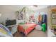 Bedroom features a canopy bed, desk and closet area at 6713 Guidestar St, North Las Vegas, NV 89084