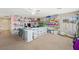 Spacious bonus room featuring ample storage with rows of shelves and plastic storage containers at 6713 Guidestar St, North Las Vegas, NV 89084