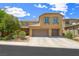 Two-story home featuring a three-car garage, neutral stucco, decorative shutters, and manicured landscaping at 6713 Guidestar St, North Las Vegas, NV 89084