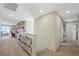 Upper level hall featuring neutral carpet, neutral decor and open access to additional rooms at 6713 Guidestar St, North Las Vegas, NV 89084