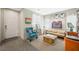 Inviting living area with comfortable seating, soft natural light, and views of the front entrance at 6713 Guidestar St, North Las Vegas, NV 89084