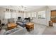 Spacious living room featuring plank flooring, neutral decor, and lots of natural light at 6713 Guidestar St, North Las Vegas, NV 89084
