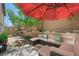 Inviting patio area with outdoor furniture, perfect for entertaining and enjoying the backyard at 6713 Guidestar St, North Las Vegas, NV 89084