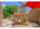 Backyard wooden playground with a swing and climbing apparatus for active outdoor fun at 6713 Guidestar St, North Las Vegas, NV 89084