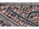 An aerial view of a community featuring homes with pools and well-maintained landscaping at 6726 Montezuma Castle Ln, North Las Vegas, NV 89084