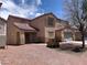 Charming home with a red tile roof, two-car garage and desert landscaping at 6726 Montezuma Castle Ln, North Las Vegas, NV 89084