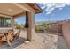 Landscaped backyard offers a covered patio area, manicured plants, and tranquil gravel accents at 6934 Alexandrite Peak St, Las Vegas, NV 89148