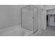 Bright bathroom features a glass shower, soaking tub, and convenient access to the walk-in closet at 6934 Alexandrite Peak St, Las Vegas, NV 89148