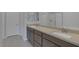 Bathroom with dual sinks, modern cabinetry, and a glass-enclosed shower at 6934 Alexandrite Peak St, Las Vegas, NV 89148