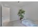 This bedroom is bathed in natural light and offers a cozy ambiance with the palm tree at 6934 Alexandrite Peak St, Las Vegas, NV 89148