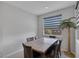 Dining room with a table and seating for six near the windows at 6934 Alexandrite Peak St, Las Vegas, NV 89148