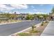 Gated entrance to a residential community, with desert landscaping and contemporary home designs at 6934 Alexandrite Peak St, Las Vegas, NV 89148