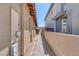 Home exterior featuring a stone pathway between two homes to an enclosed courtyard at 6934 Alexandrite Peak St, Las Vegas, NV 89148