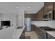 Bright kitchen offers stainless steel appliances, a large island, and modern cabinetry at 6934 Alexandrite Peak St, Las Vegas, NV 89148