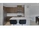 Well-lit kitchen features stainless steel appliances, a spacious island, and stylish backsplash at 6934 Alexandrite Peak St, Las Vegas, NV 89148