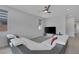 Bright and airy living space featuring a modern sectional and a sleek ceiling fan at 6934 Alexandrite Peak St, Las Vegas, NV 89148