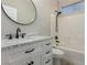 Bathroom features a vanity with marble countertop and shower-tub combo at 71 Blaven Dr, Henderson, NV 89002