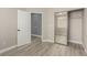 Bedroom features a door to another room, a closet, and light wood floors at 71 Blaven Dr, Henderson, NV 89002