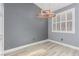 This dining room boasts modern light fixture, plantation shutters, and neutral paint at 71 Blaven Dr, Henderson, NV 89002