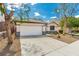 Charming single-story home featuring a two-car garage, desert landscaping, and a well-maintained front yard at 71 Blaven Dr, Henderson, NV 89002