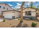 Single story home with desert landscaping and a well-manicured front yard and an attached two-car garage at 71 Blaven Dr, Henderson, NV 89002
